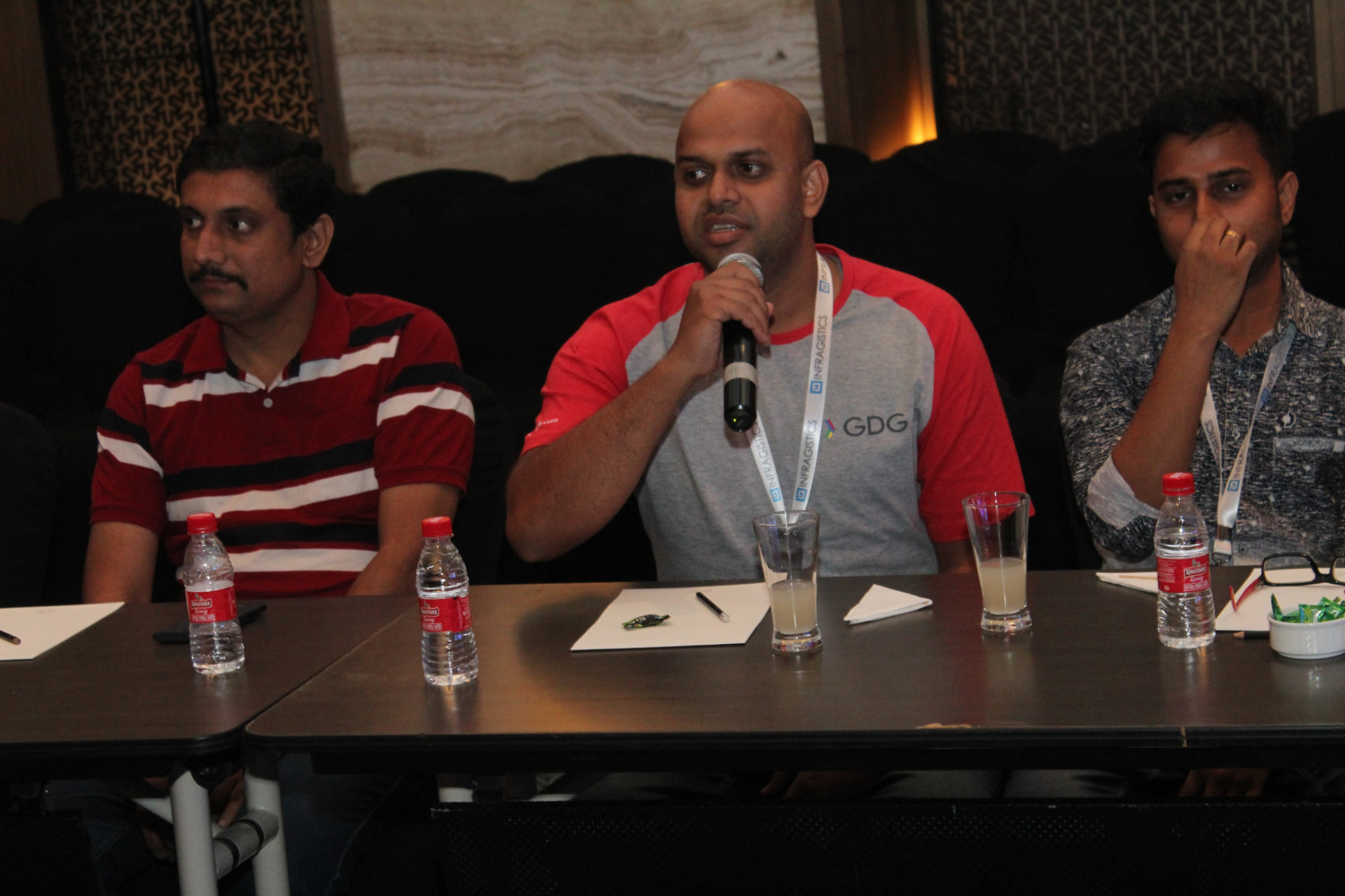 Suvendu Shekhar Giri speaking into a microphone during a panel discussion at the C# Corner Annual Conference 2018